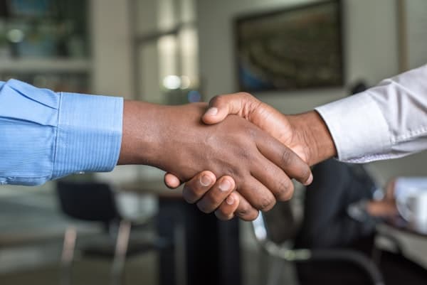 Contractor shaking hands with a client