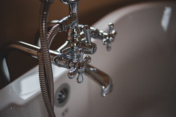 Plumber fixing pipes